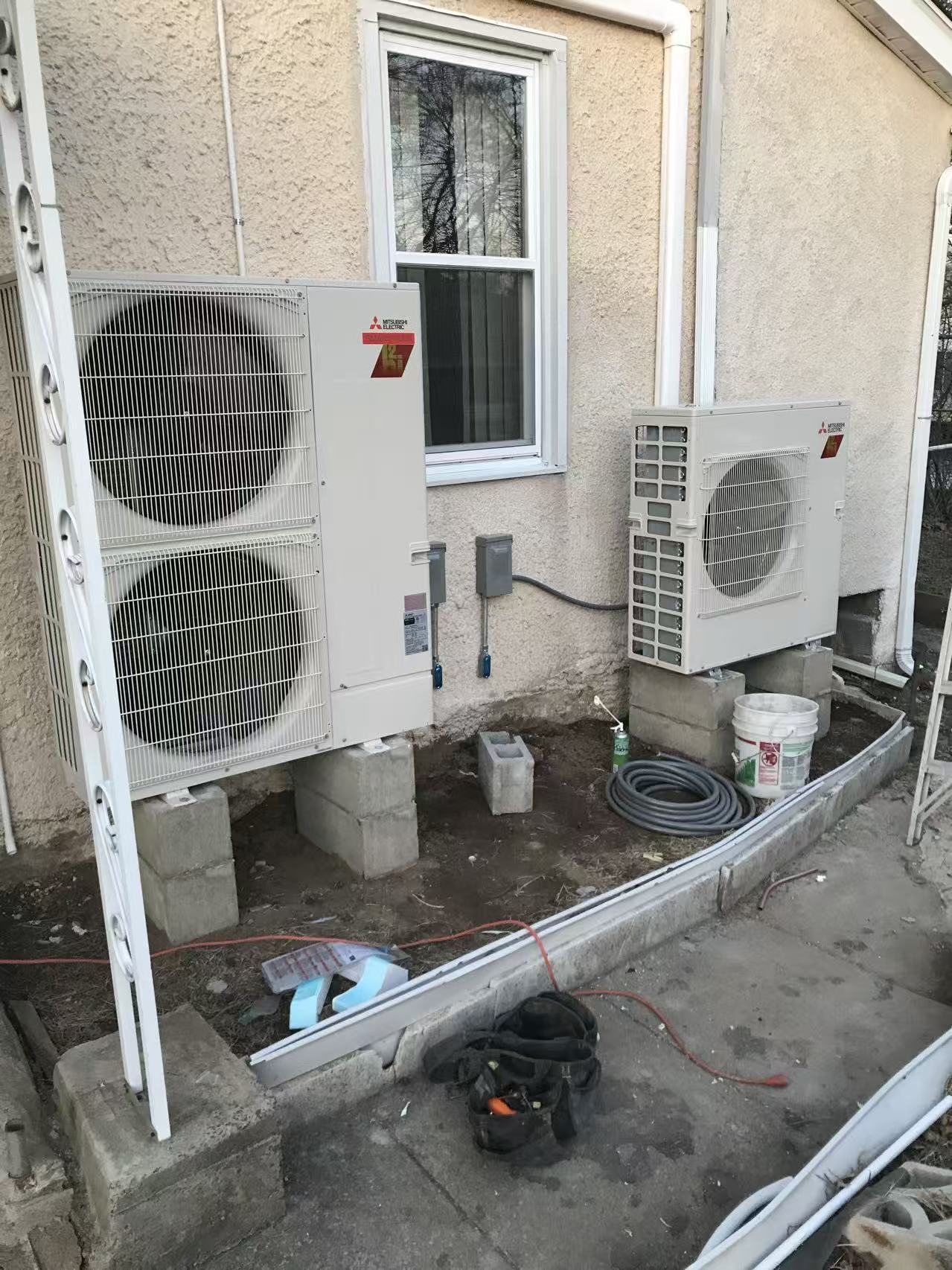 Outdoor mini-split equipment installed beside a home